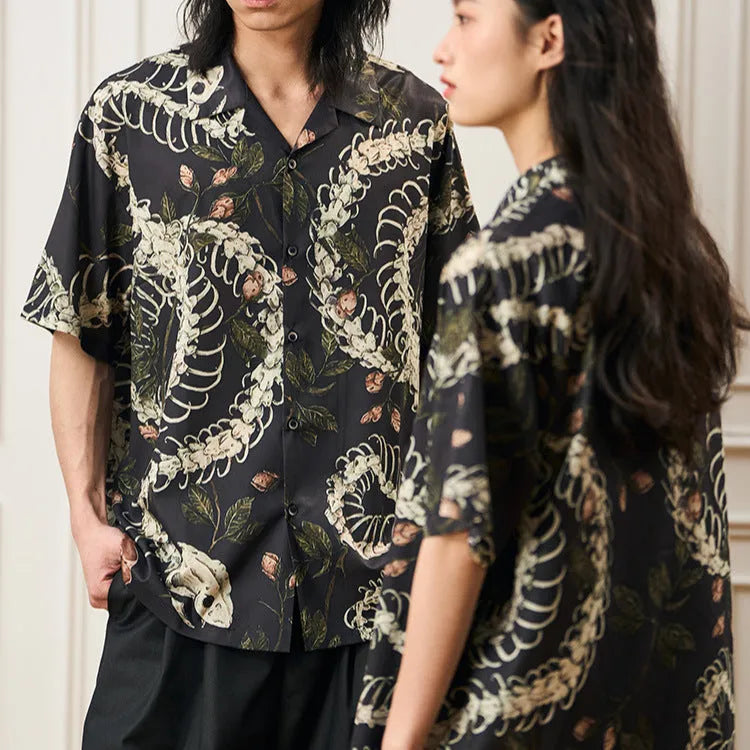 Snake bone floral pattern printed on light blue polyester Cuban collar shirt with short sleeves