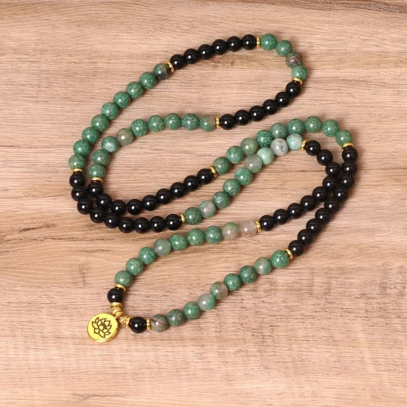 Green and black elastic beaded long bracelet with alloy material and adjustable sizing