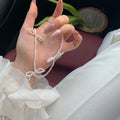 Women's pearl necklace with bow design and adjustable 31-40cm length