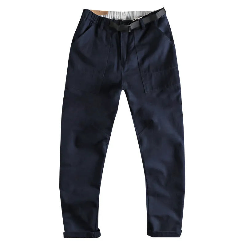 Men's khaki and dark blue cotton work trousers with a 3D cut and zip fly.
