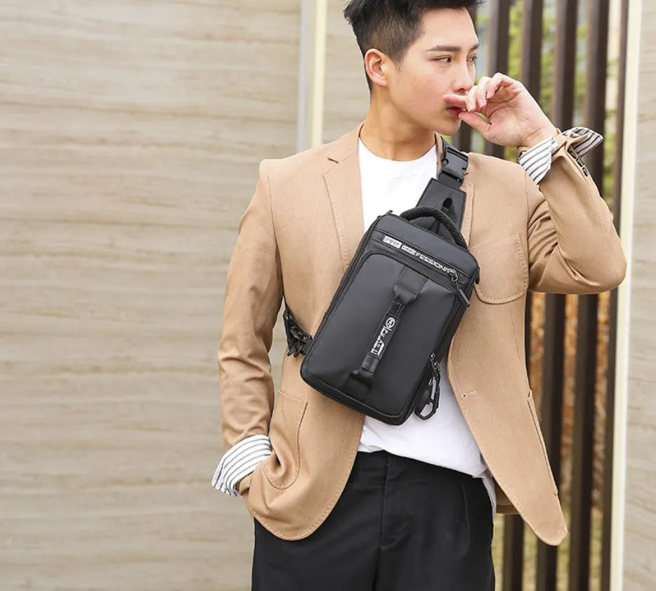 Oxford cloth chest bag in khaki with zip opening, internal zipper pocket, soft handle, and square vertical section shape