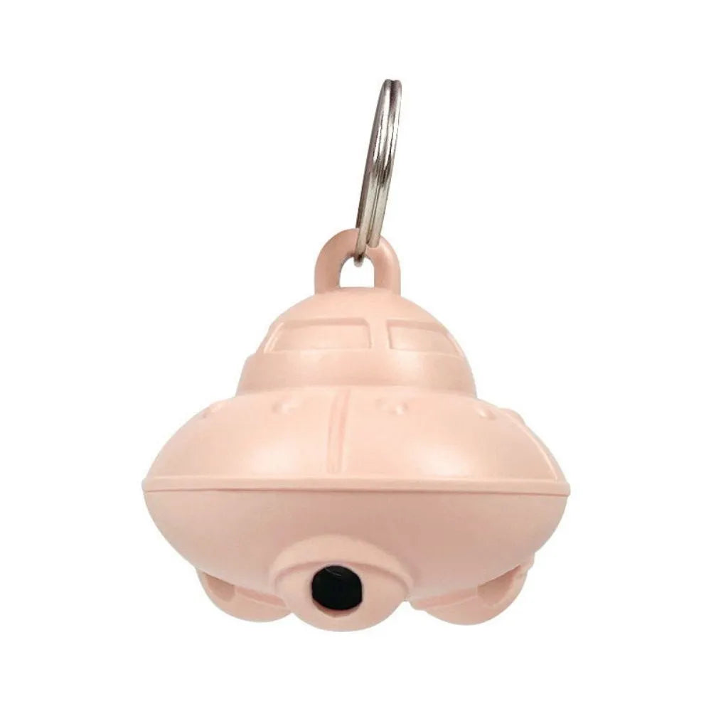 Small green plastic automatic laser toy attached to a cat collar for hands-free interactive pet play.