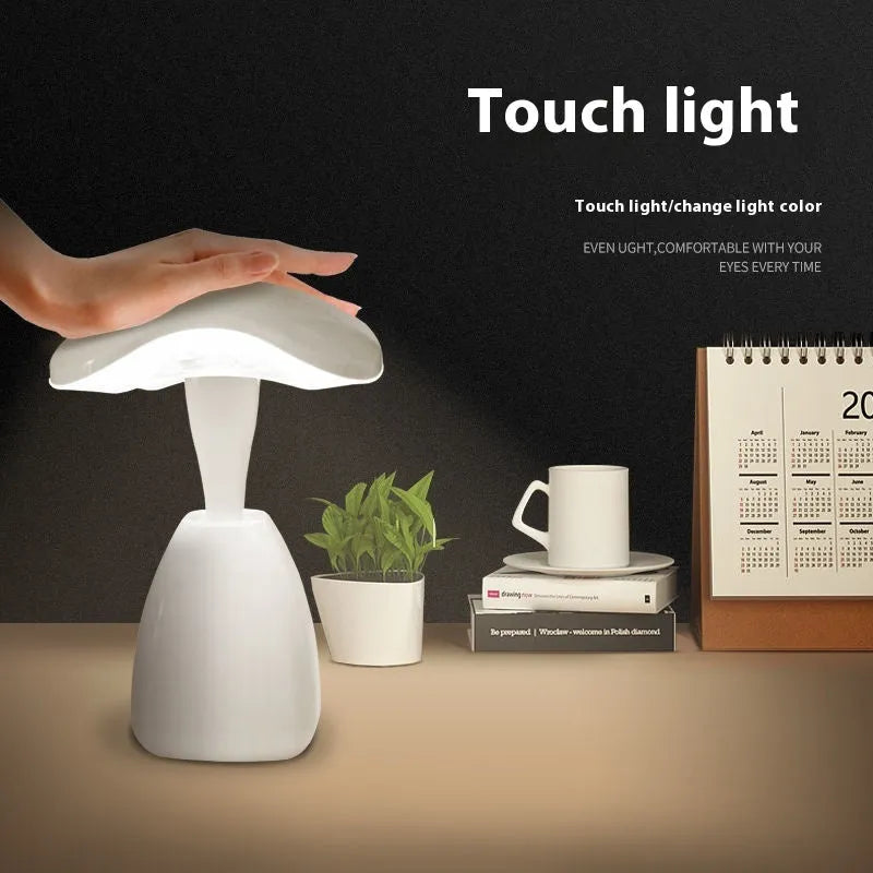 White modern LED desk lamp with touch control and plastic shade for bedside or desk use