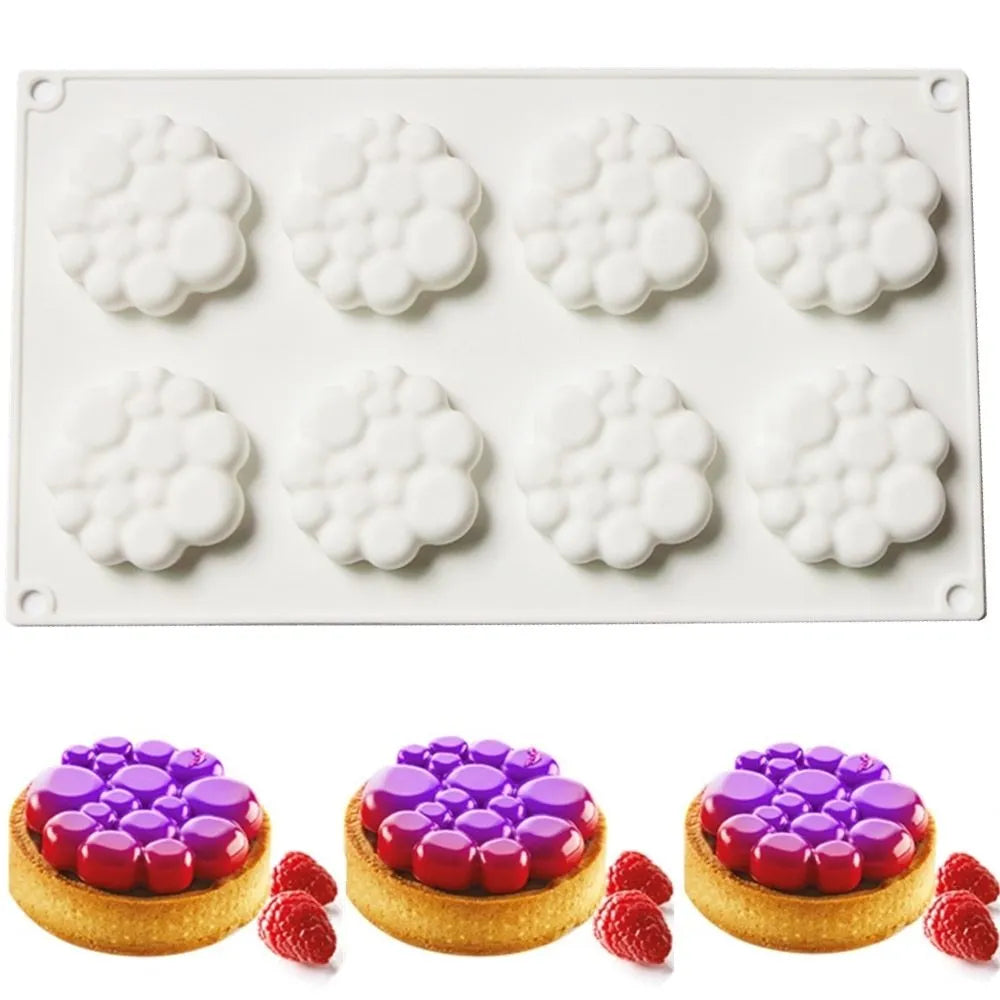 Round silicone cake mould with 8 bubble tower pattern design on a kitchen worktop.