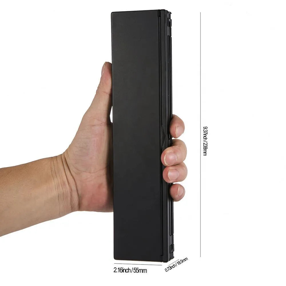 Mini folding ultra-thin wireless Bluetooth keyboard in black or white for tablets and smartphones.