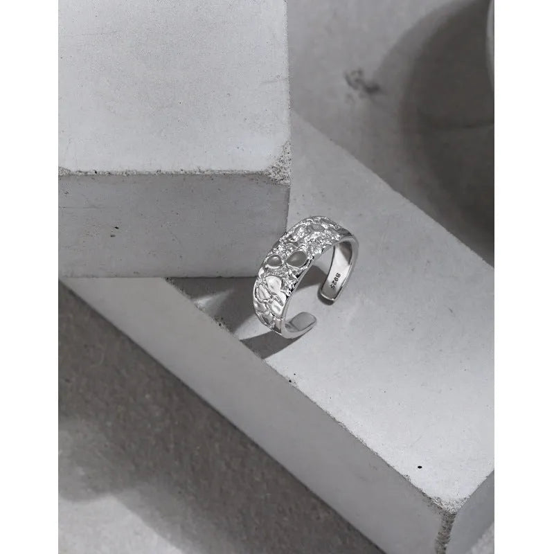 Adjustable opening silver ring with hammered texture in white gold colour finish