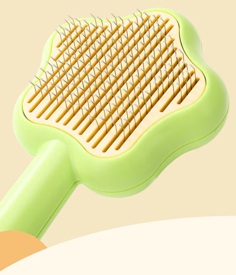 Green cat grooming comb with stainless steel needles and self-cleaning feature, 20cm length