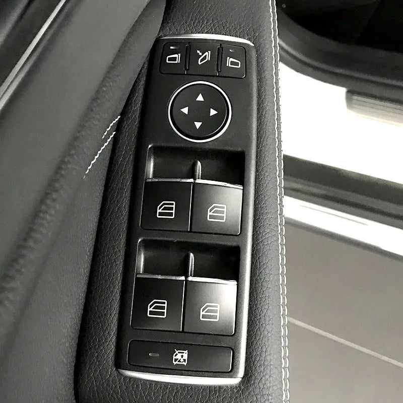 Black glitter window lift button modification sticker measuring 6cm by 3cm with adhesive backing
