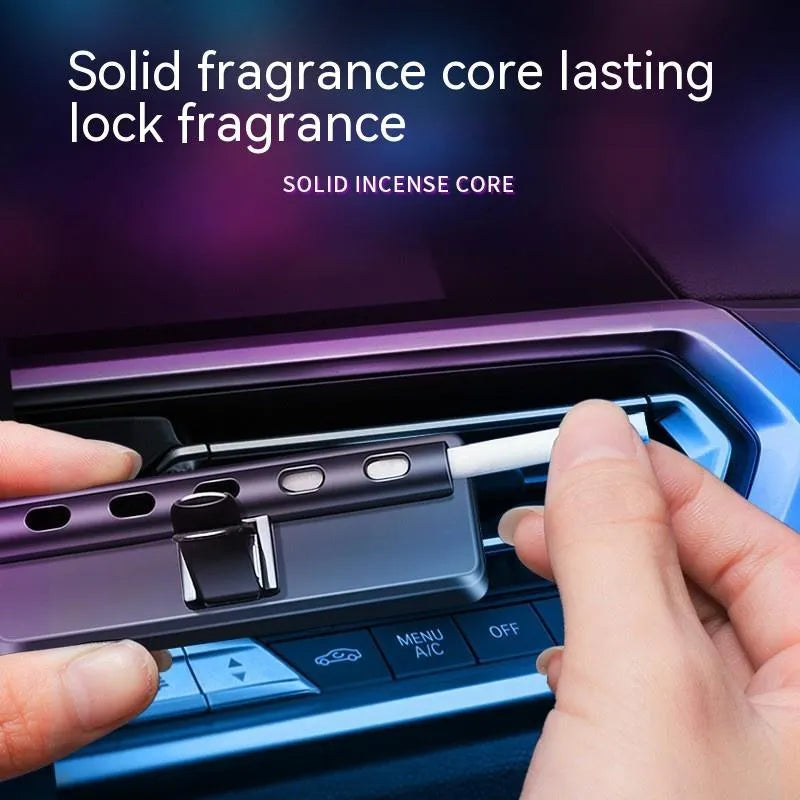 Black car air vent aromatherapy light with LED illumination and fragrance stick inserted