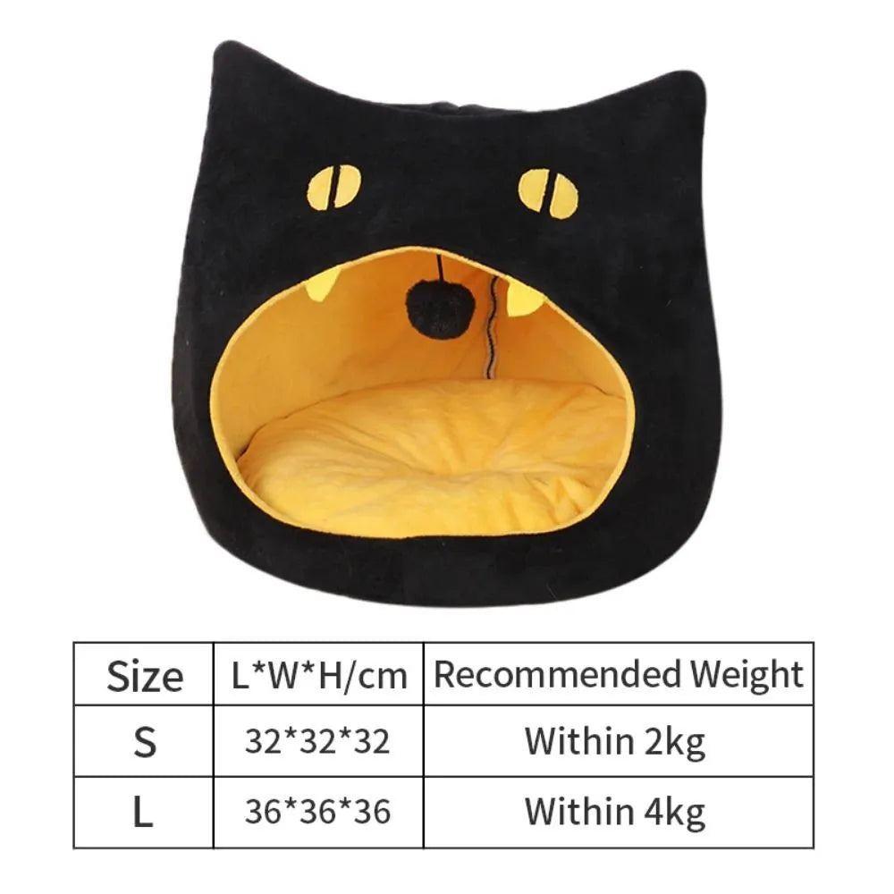 Grey covered cat cave pet bed with cat face design and anti-slip bottom.