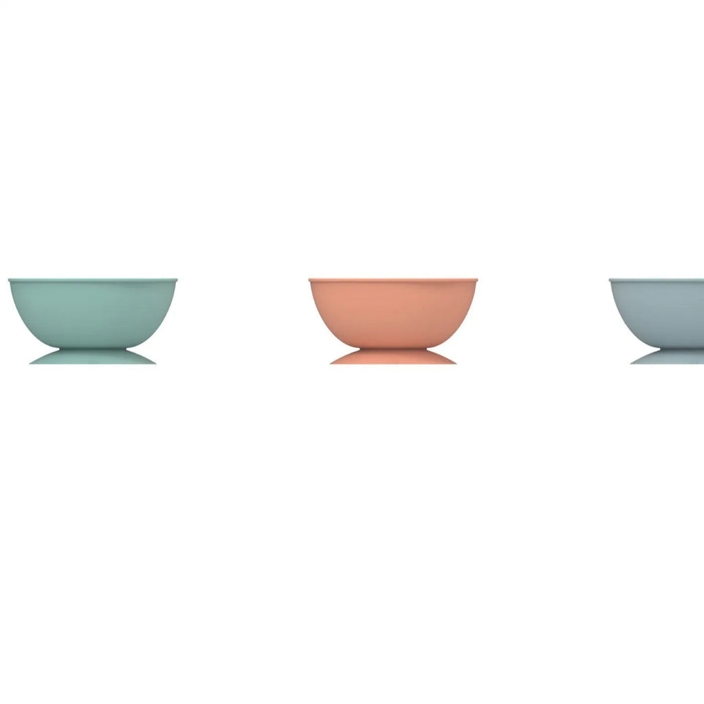 Cyan silicone dog bowl with textured feeding surface and suction cup base, measuring 15.8cm across