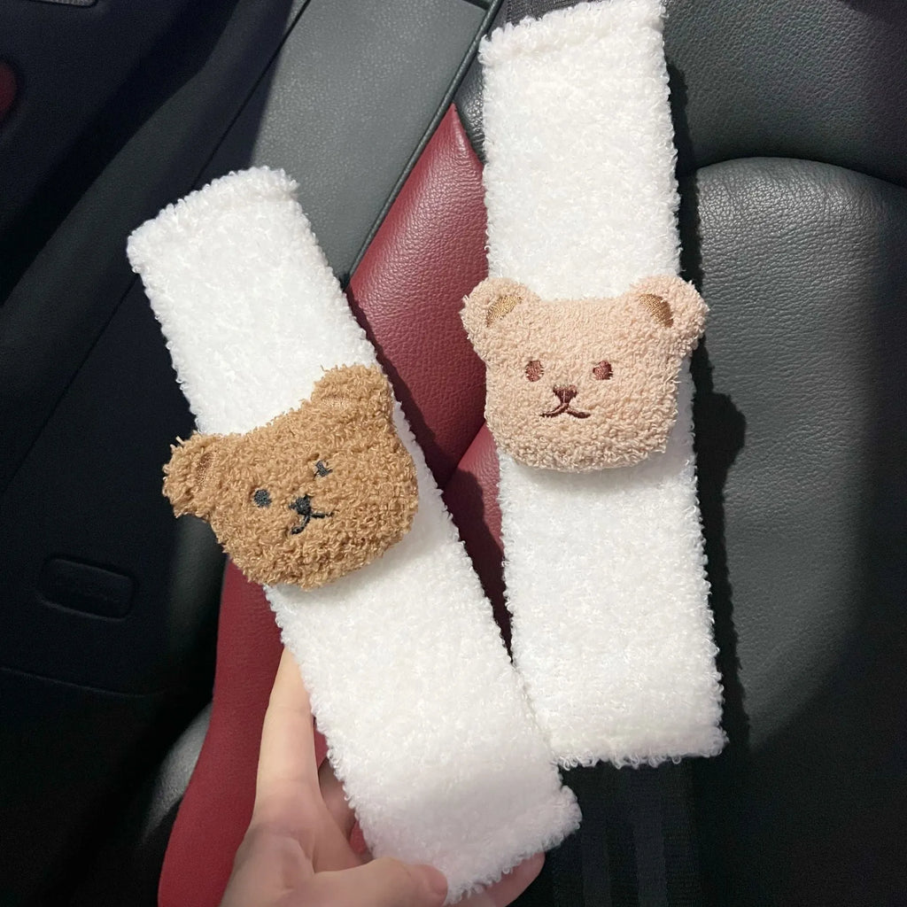 Cartoon bear design plush car seat belt protective cover for infant safety, showing khaki and coffee colour options