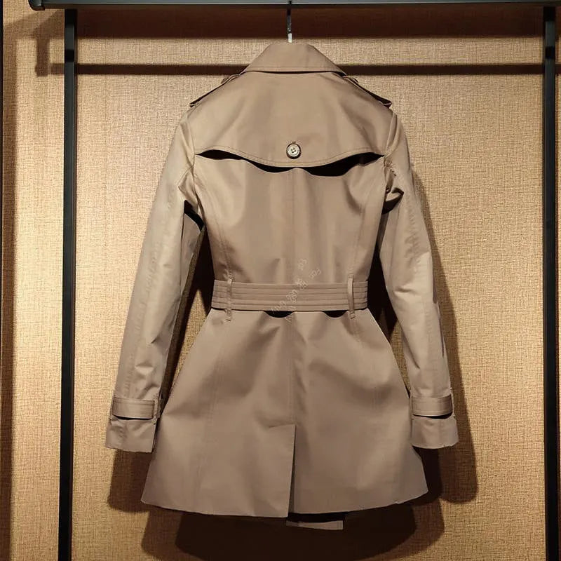Khaki women's trench coat with double-breasted button front and distinctive flight sleeves