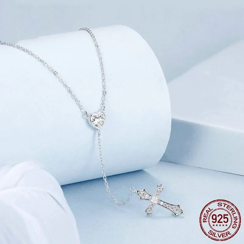 Silver cross necklace on O-ring chain with V-neck pendant design