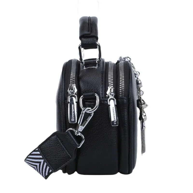 Oval-shaped women's small square bag in PU with double shoulder strap and internal phone pocket.