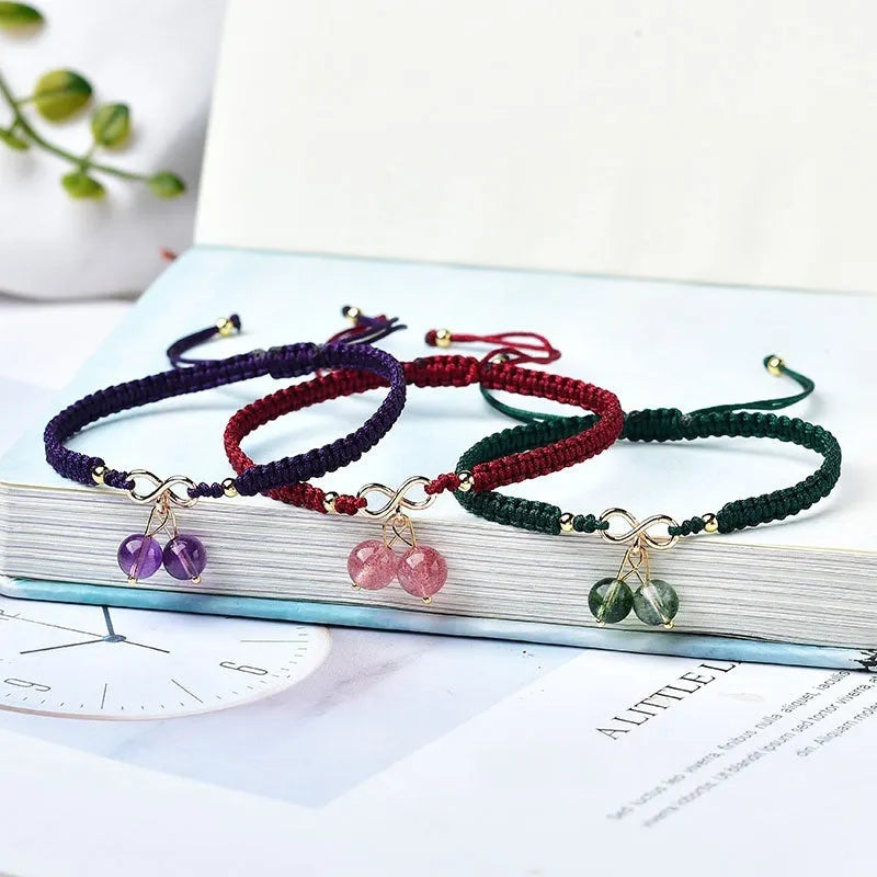 Adjustable strawberry quartz cherry bracelet with 8mm beads on wrist showing natural inclusions