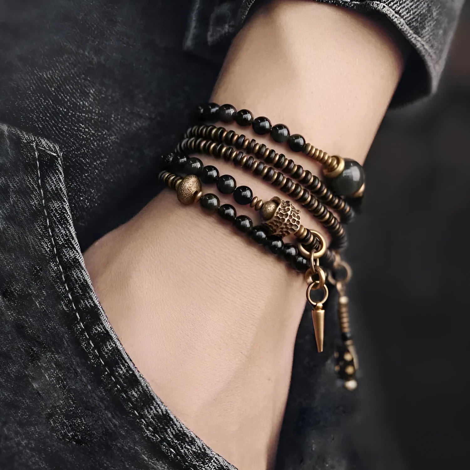 Black multi-layered beaded bracelet with colourful geometric and natural style beads.