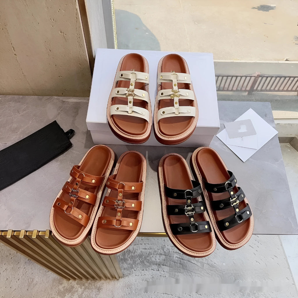 Women's white patent leather Roman sandal slippers with sheepskin upper on a wooden floor