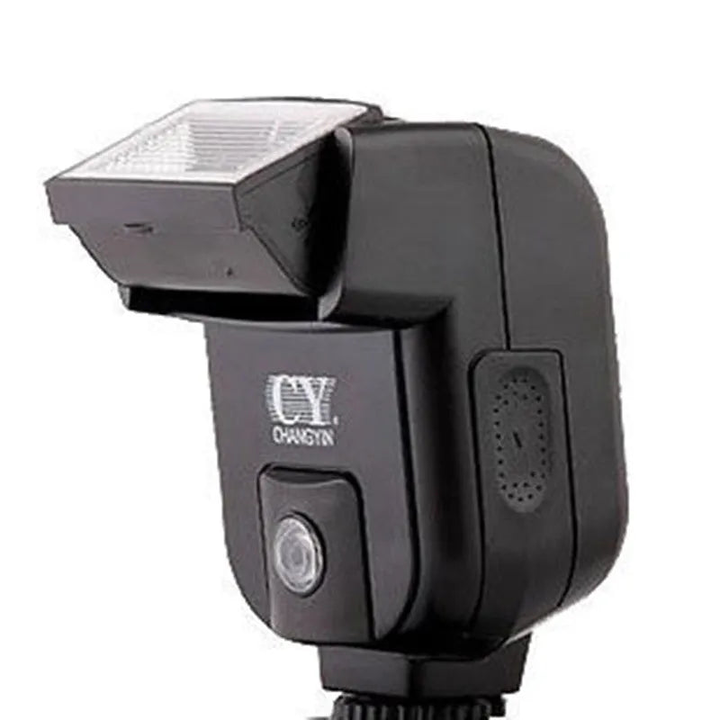 Compact silver SLR camera flash with tilted head mounted on a camera hot shoe