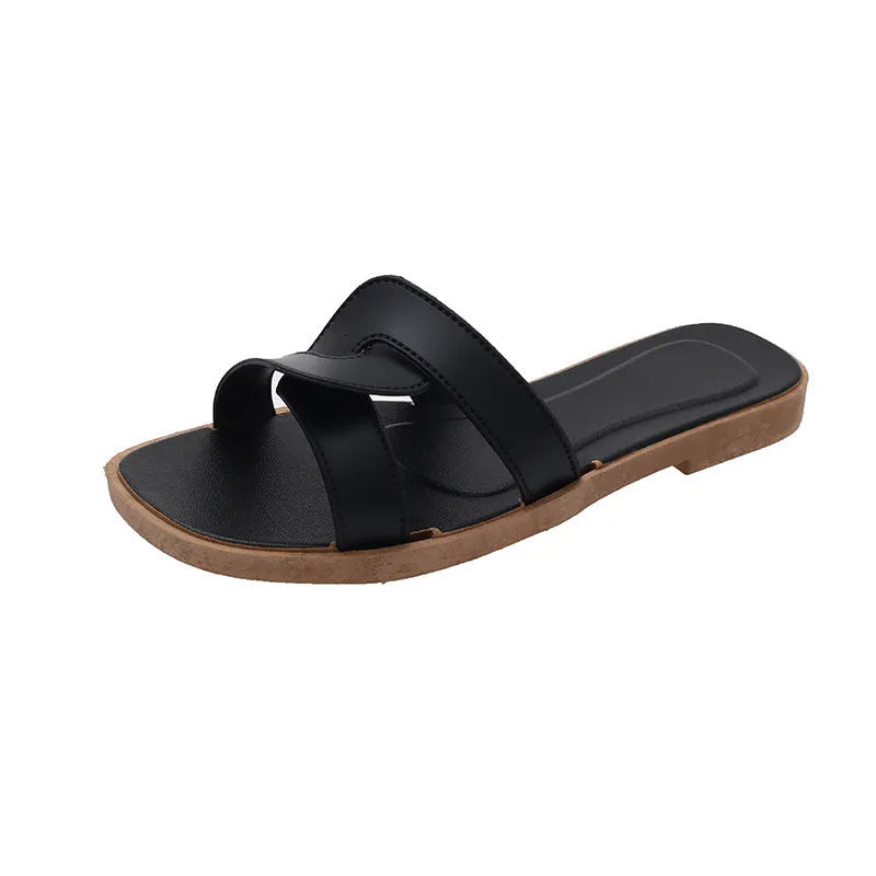 Women's PVC cross strap toe ring flip flops in light blue on a white background.