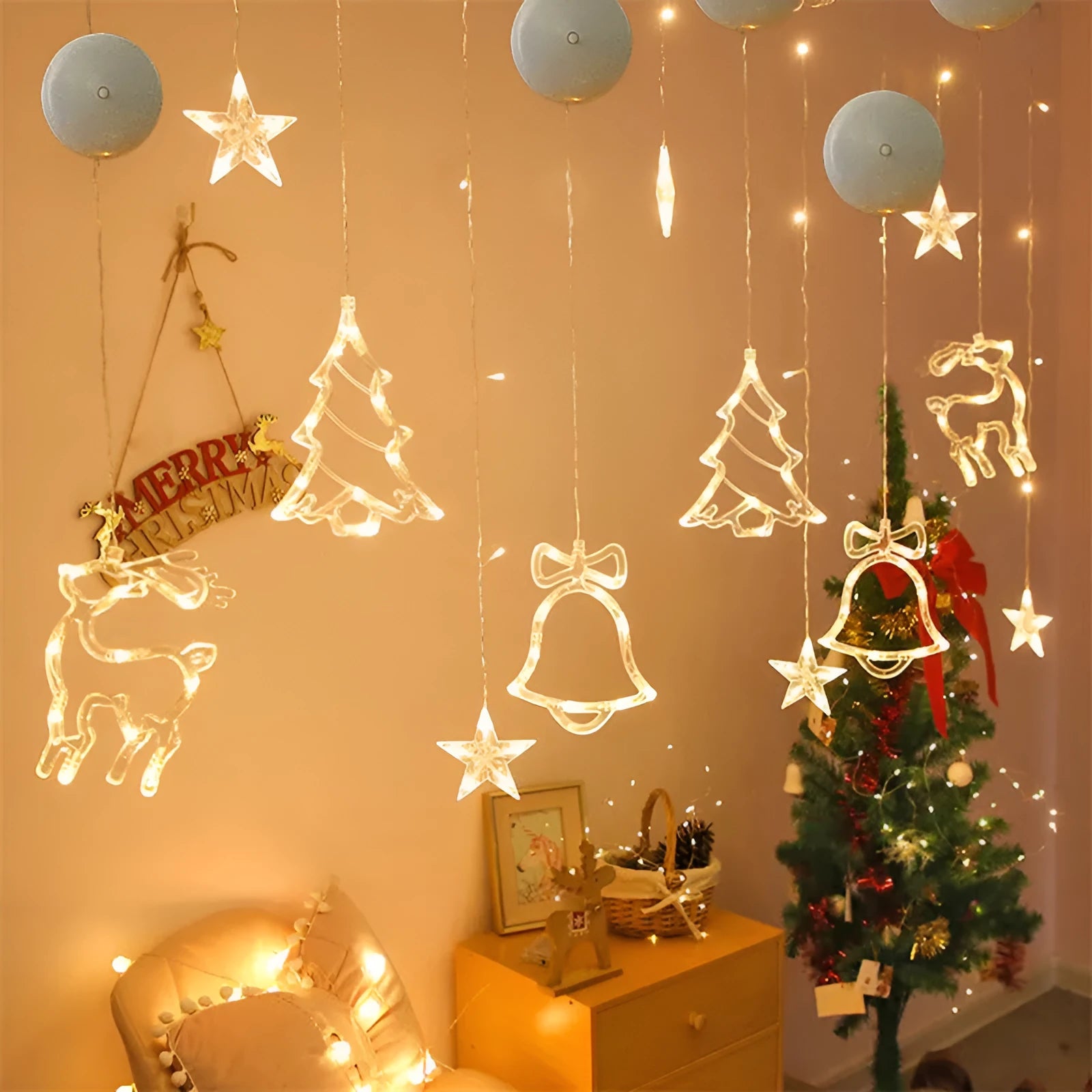 Battery-powered Christmas LED light set with Santa Claus, elk, and snowman designs stuck to a window with suction cups.