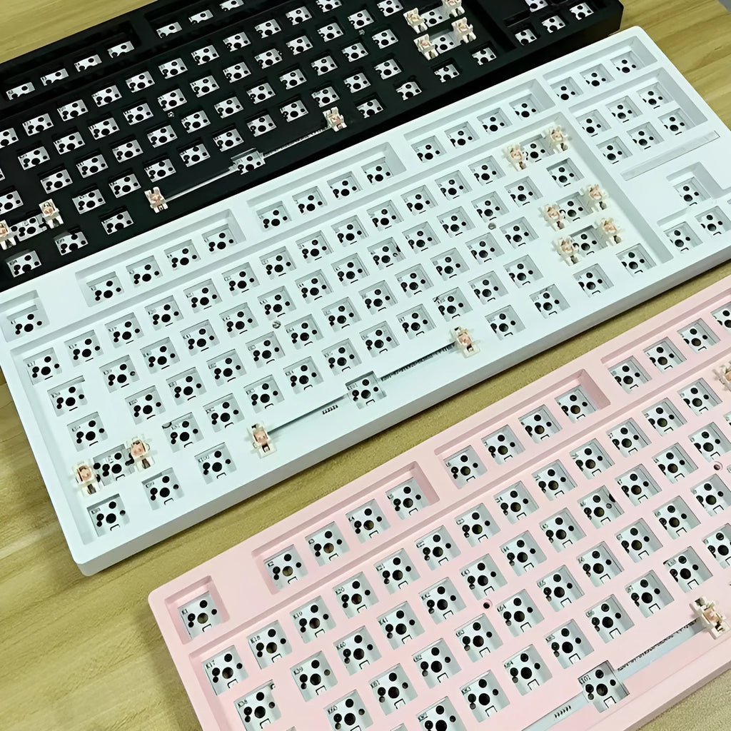 DIY mechanical keyboard kit with hot-swappable seat in multiple colour options including black, white, pink, and transparent cases