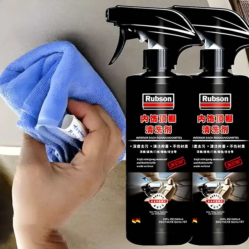 Bottle of enzyme-based fabric ceiling cleaner with towel and sponge wipes on a car roof