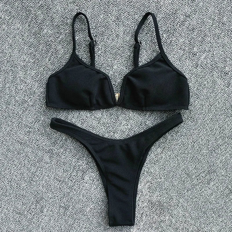 Women's two-piece bikini set in polyester with top and shorts, available in five colours and sizes S to XL.