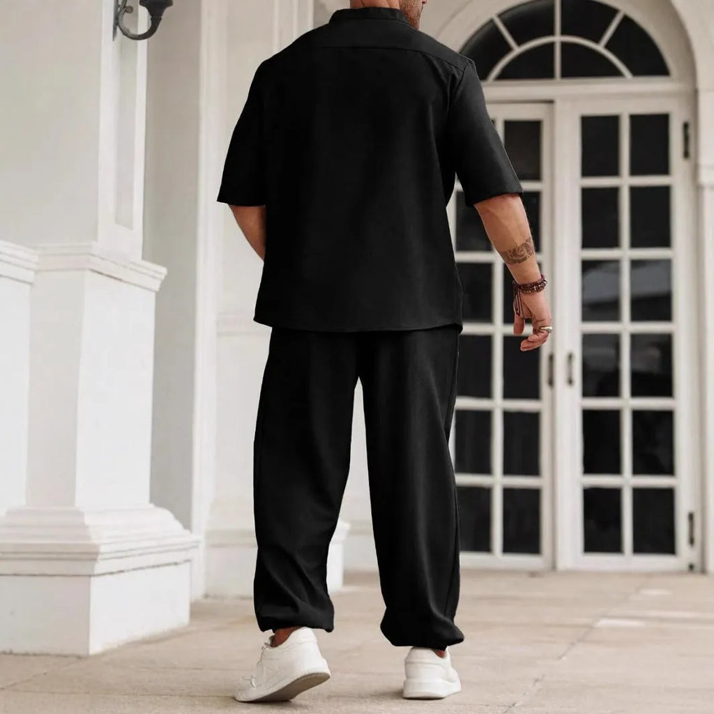 Men's apricot coloured cotton linen casual short-sleeved shirt and matching trousers laid flat.