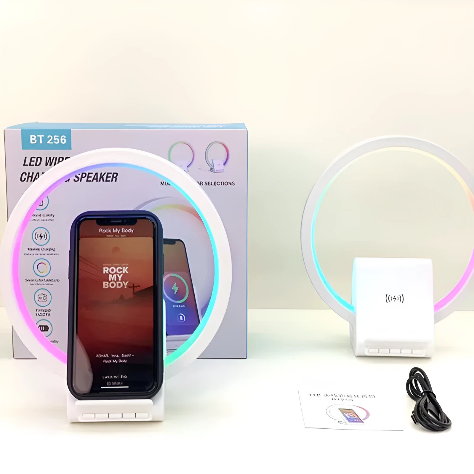 White rectangular 15W wireless charging pad with integrated Bluetooth speaker and ambience light.