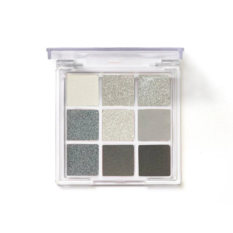 Smoked nine-colour eye shadow palette showing shades including white, silver, black, and iron grey.