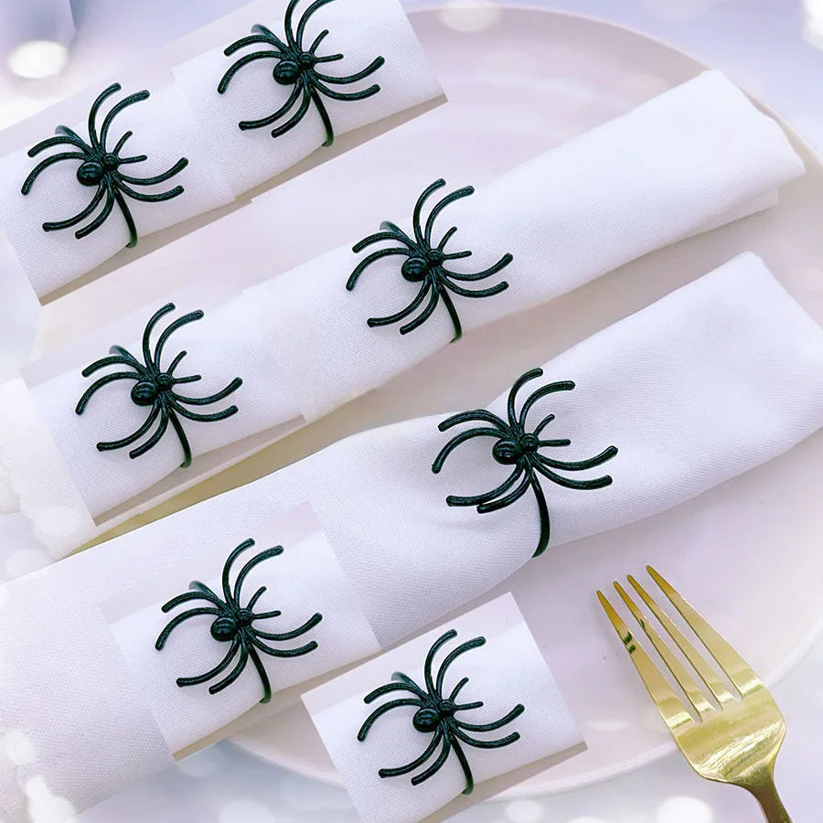 Six black spider-shaped alloy napkin rings for Halloween table decorations with electrophoresis surface finish