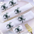 Six black spider-shaped alloy napkin rings for Halloween table decorations with electrophoresis surface finish