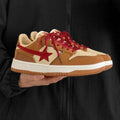 Brown low-top women's platform sneakers with sequin details and lace-up front.