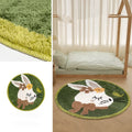 Round light pink polyester floor mat with a cute white rabbit illustration on a wooden floor.