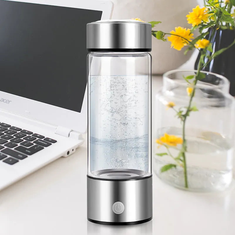 Hydrogen water bottle with borosilicate glass cylinder and electric hydrogen generator in silver colour