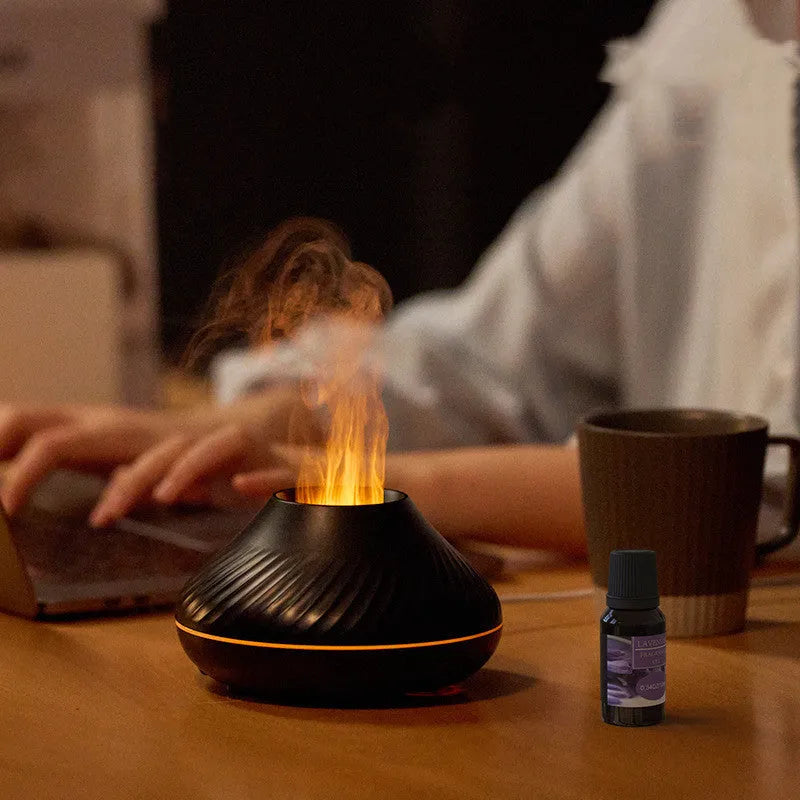 Beige USB aromatherapy diffuser with flame effect lighting on wooden table