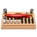20-piece steel watch repair barrel-opening tool set on a workbench