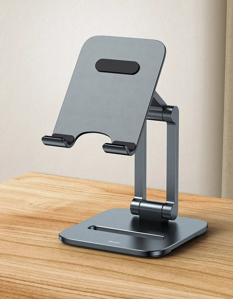 Deep space grey aluminium folding stand holding a tablet and a mobile phone on a desk.