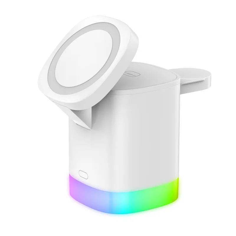 Black 3 in 1 magnetic wireless charging cube showing iPhone, Apple Watch and AirPods charging simultaneously with RGB lights