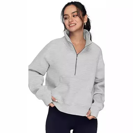 Women's loose fit lapel sweater with fleece lining and long raglan sleeves in a solid colour.