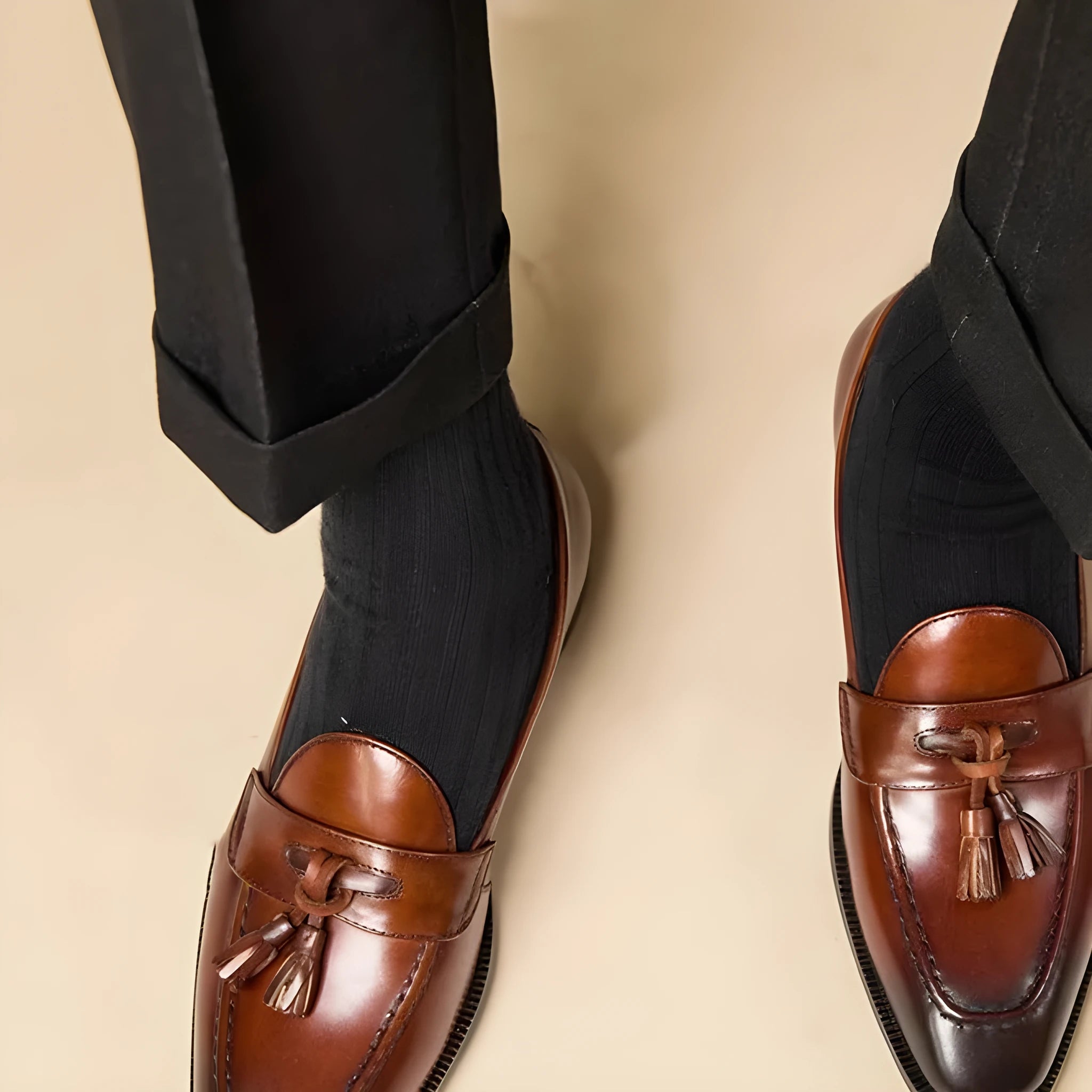 British-style tassel loafers in polished leather with rubber sole and pigskin lining