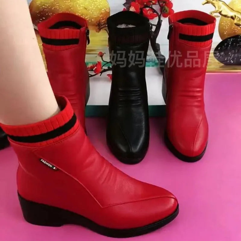 Pair of women's mid heel square heel ankle boots with side zipper and artificial plush lining in black or red