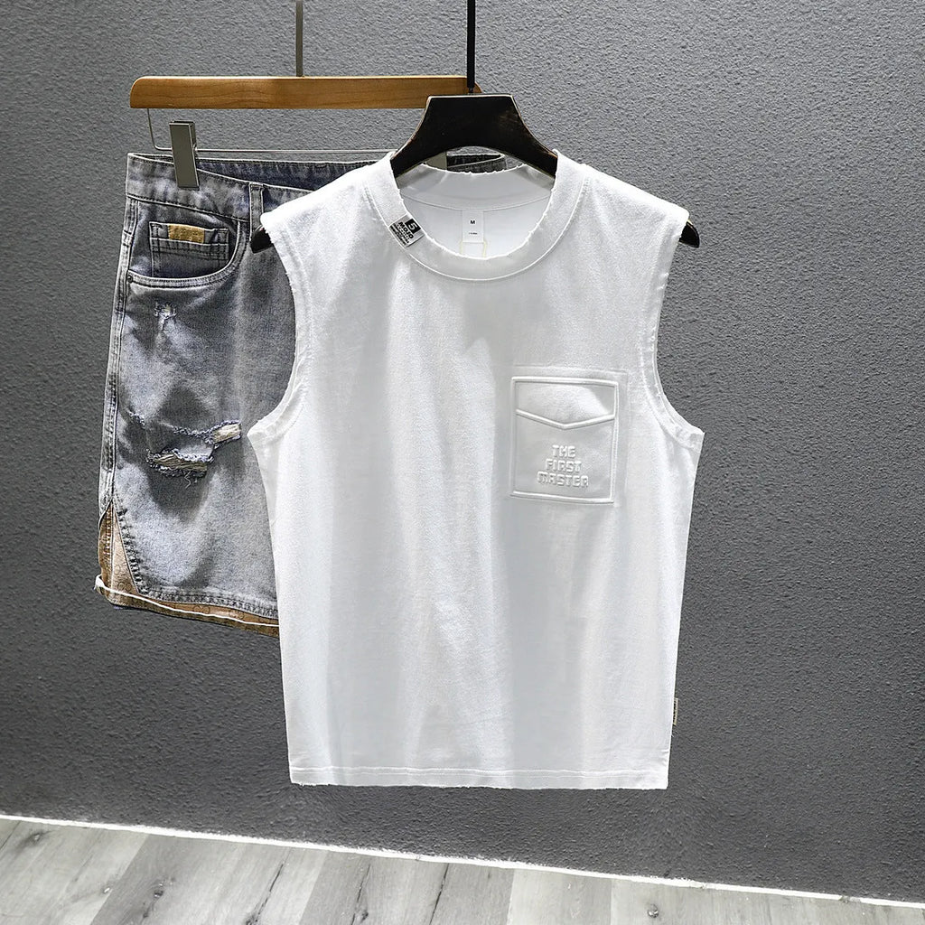 Solid colour loose fit cotton sleeveless t-shirt on a hanger, shown in black and white colour options.
