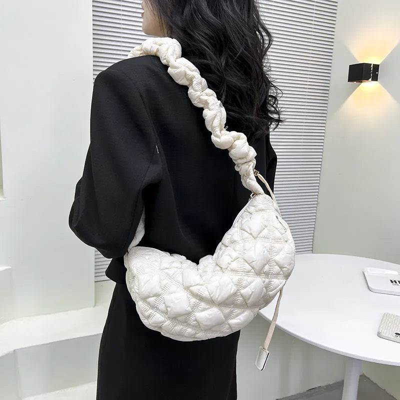 Women's nylon underarm bag in beige colour showing 35cm width and adjustable 120cm shoulder strap