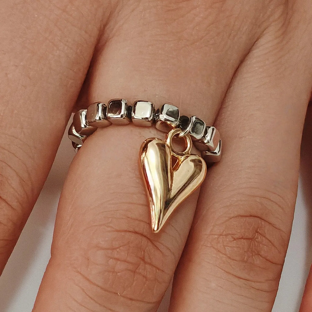 Handmade beaded elastic love ring with geometric heart design in gold and white colour options
