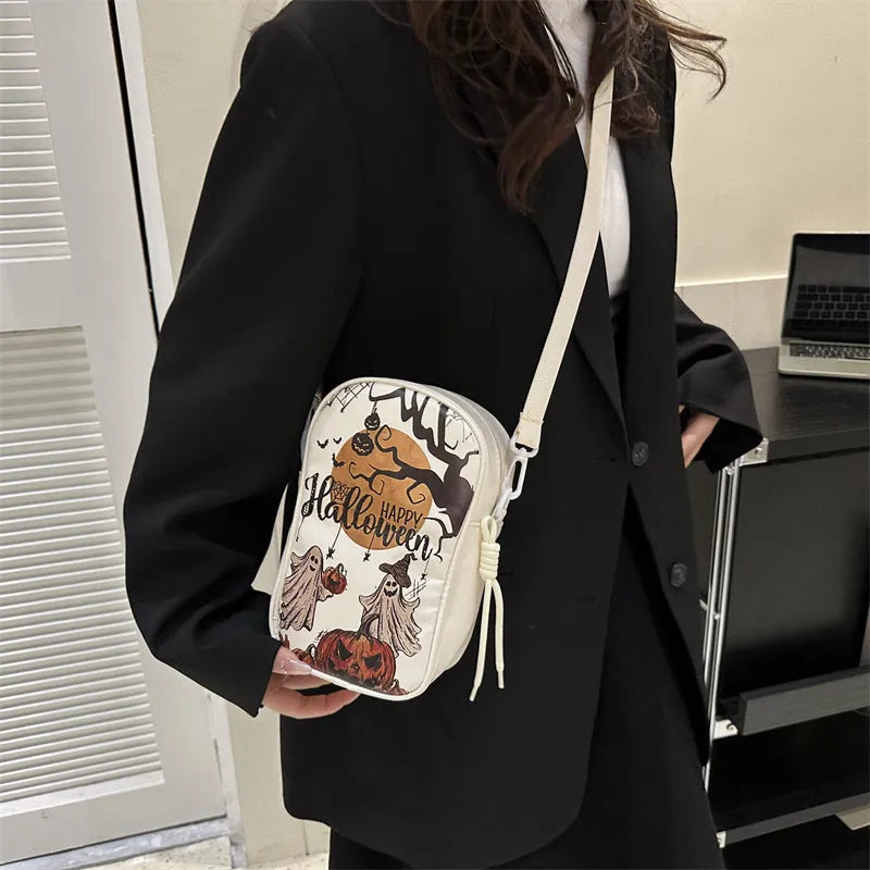 Halloween graffiti crossbody phone bag with pumpkin ghost bat print, 14x23x9.5cm dimensions, PU material