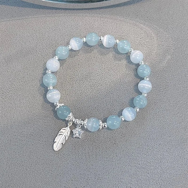 Korean style glass bracelet with feather XINGX blue moonlight colour and eight Awn star decorative elements