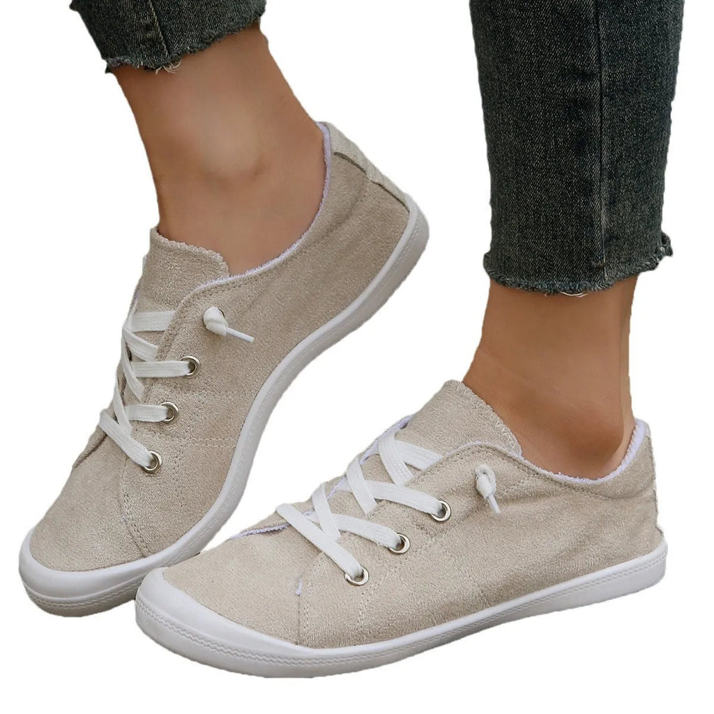 Women's creamy-white casual sneakers with fabric upper and rubber sole, low-top design for versatile wear