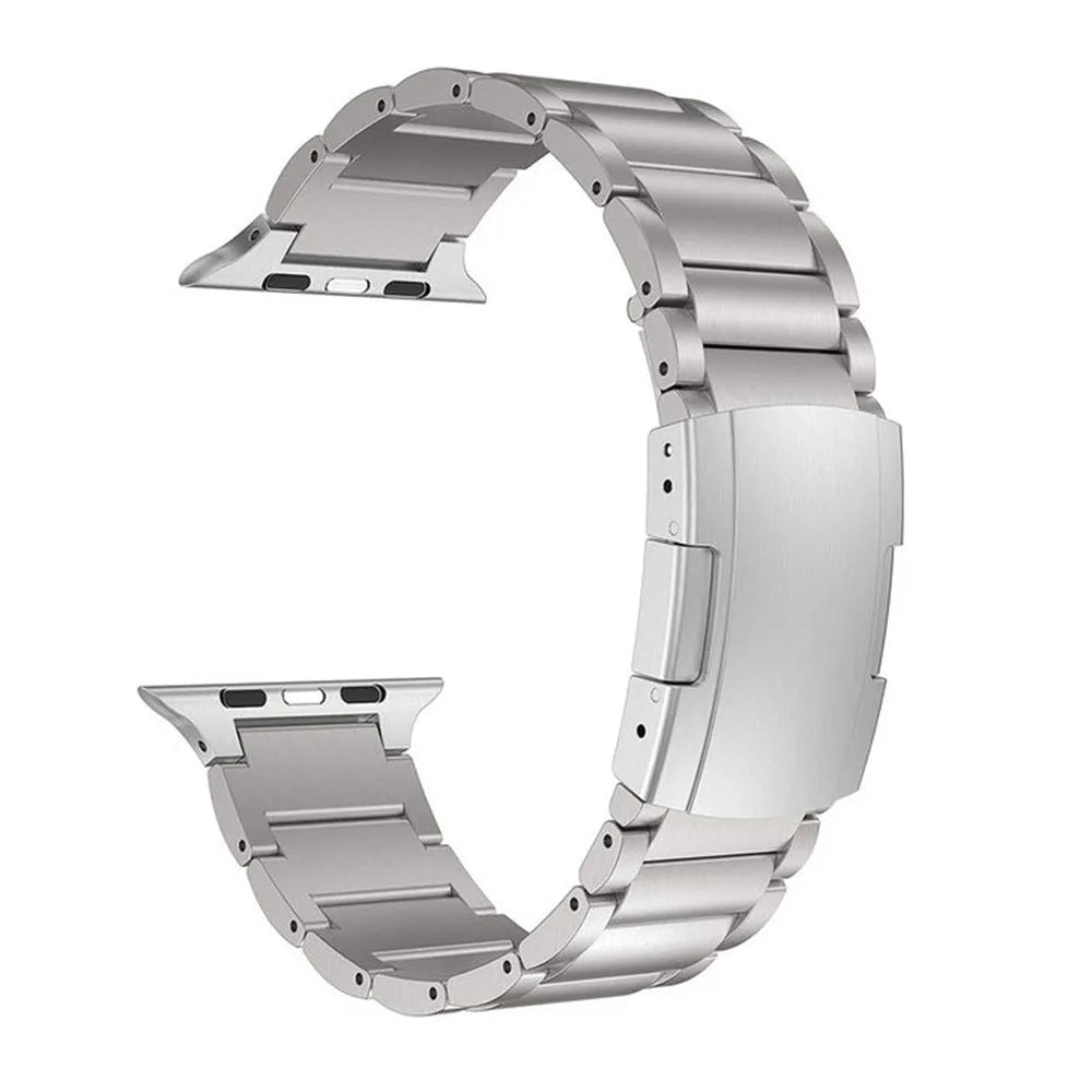 Black titanium alloy Apple Watch replacement strap with folding buckle on a wrist